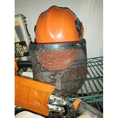 413 - A chainsaw, sharpener, protective head gear, box of chisels & level etc. COLLECT ONLY