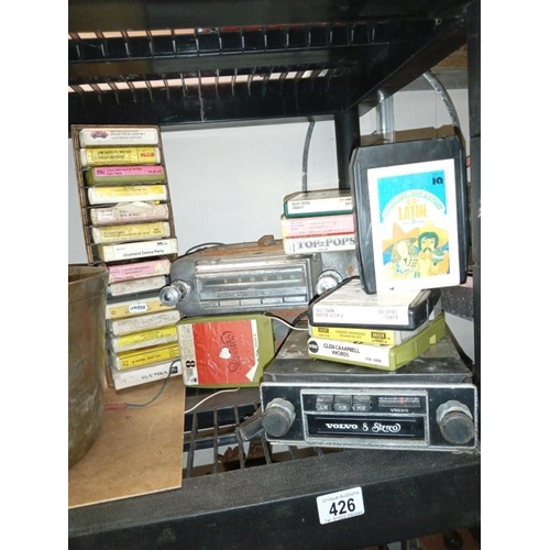 426 - A large 1950's push button (maybe Ford) radio & an original Volvo 8 stereo 8 track/radio with a lot ... 