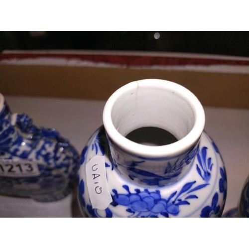 1213 - A pair of early Chinese blue & white lidded vases (both lids a/f) and a blue and white flask.