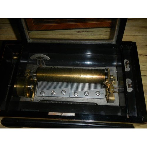 1704 - A Victorian double comb music box playing six tunes, movement in mint condition and in good working ... 