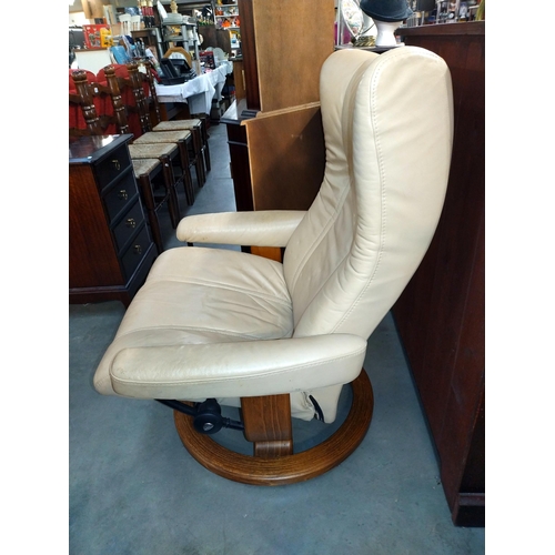 308 - A cream leather swivel recliner chair, COLLECT ONLY