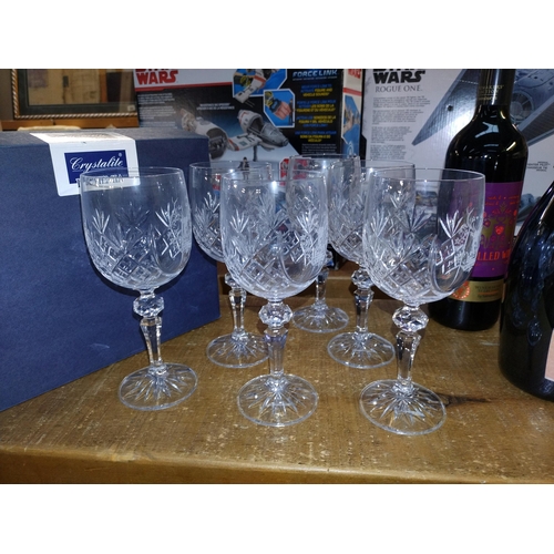 335 - A box of 6 bohemian crystal glasses featuring stags head and two bottles of alcohol, plus two miniat... 