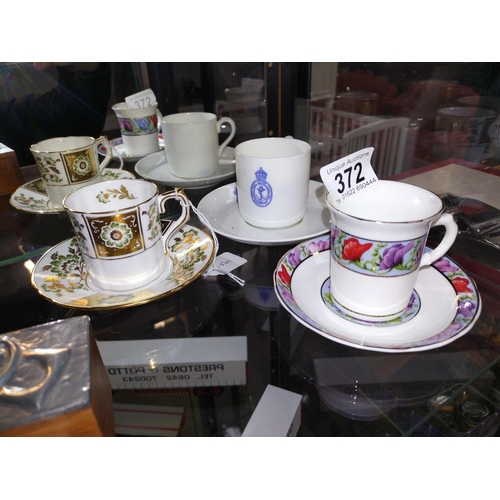 372 - A Royal Crown Derby tea cup and saucer plus 2 others