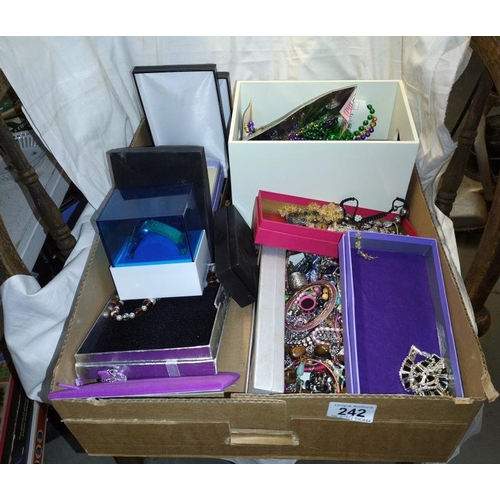 242 - A large box of assorted costume jewellery including silver