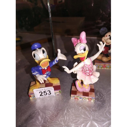 253 - 5 Disney traditions by Jim Shore figures plus 2 other Disney figures Minnie and Mickey etc