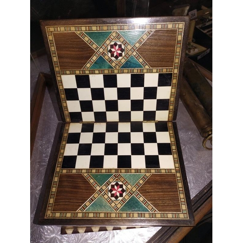 257 - An inlaid box with chessboard incorporated, chess pieces included, missing 1 black pawn