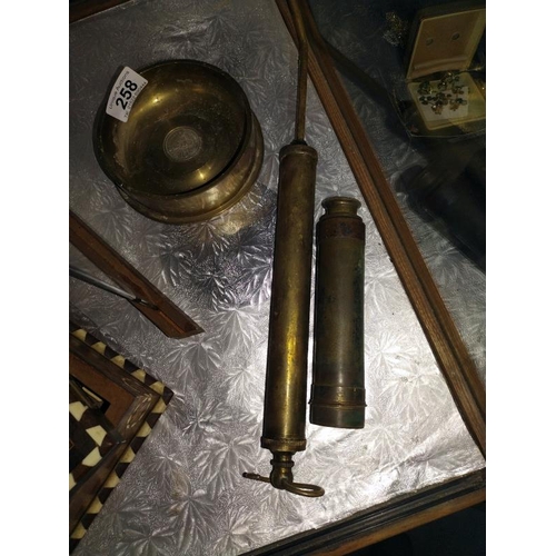 258 - A Falklands coin brass gun shell case, telescope and Halfords pump