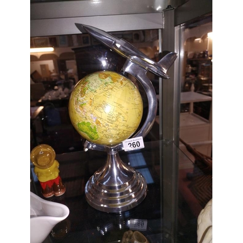 260 - An art deco style globe on polished aluminium frame with aeroplane on top height 31cm