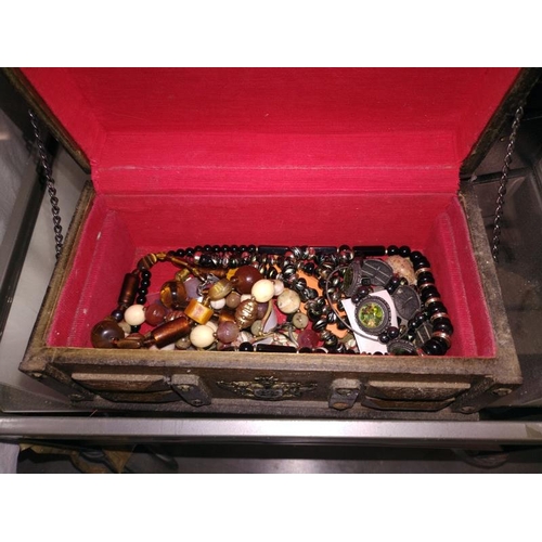 267 - A jewellery box and costume jewellery