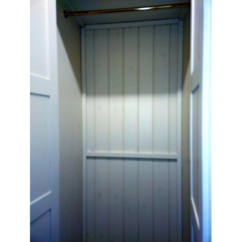 374 - A large white finished solid pine combination wardrobe (245cm x 59cm x 212cm high) COLLECT ONLY