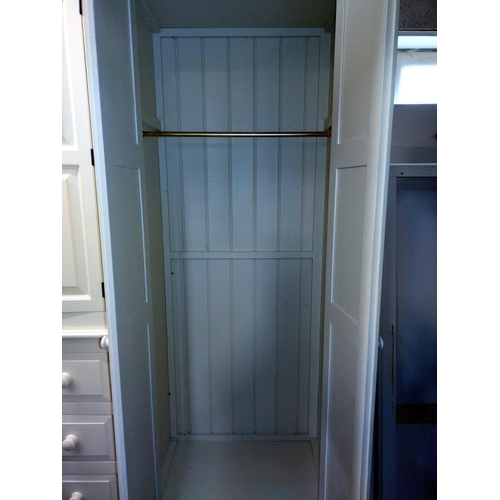 374 - A large white finished solid pine combination wardrobe (245cm x 59cm x 212cm high) COLLECT ONLY