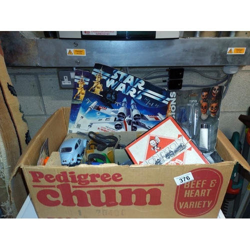 376 - A box of miscellaneous toys including vintage Monopoly, Star Wars, Denys Fisher box fronts. COLLECT ... 