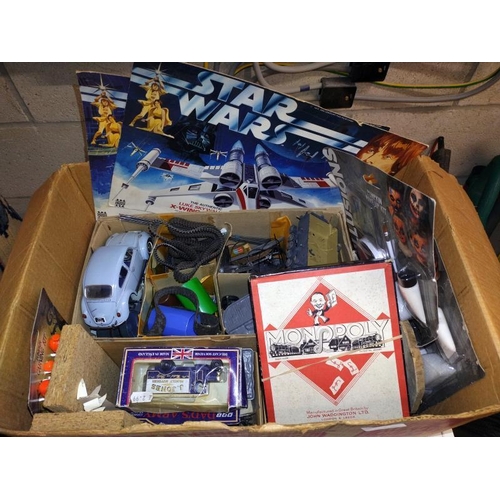 376 - A box of miscellaneous toys including vintage Monopoly, Star Wars, Denys Fisher box fronts. COLLECT ... 