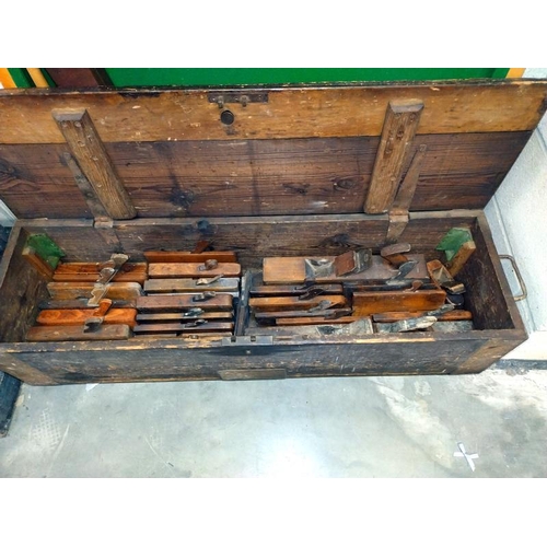 388 - A large antique tool box containing moulding planes (112cm x 33cm x 35cm high), COLLECT ONLY