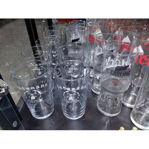 400F - A quantity of glasses including Coors light, Batemans & Carling, all in need of a clean, COLLECT ONL... 