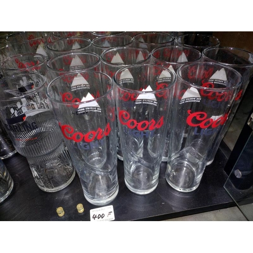 400F - A quantity of glasses including Coors light, Batemans & Carling, all in need of a clean, COLLECT ONL... 