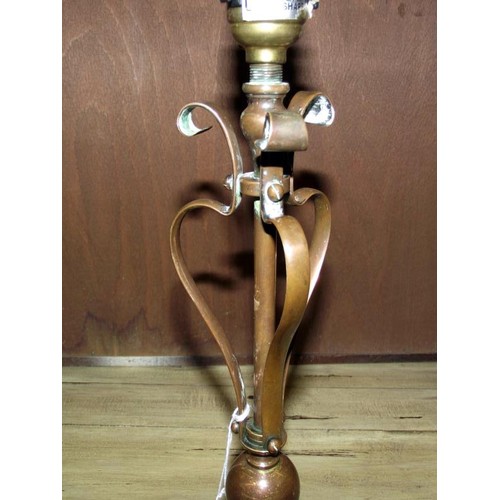 1372 - An Arts and Crafts copper lamp in the style of Benson, 34 cm tall.