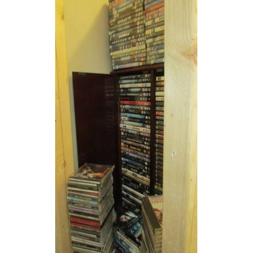 1 - A DVD cabinet with in excess of 150 DVD's and in excess of 70 CD's.