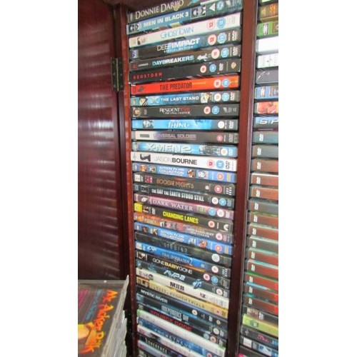 1 - A DVD cabinet with in excess of 150 DVD's and in excess of 70 CD's.