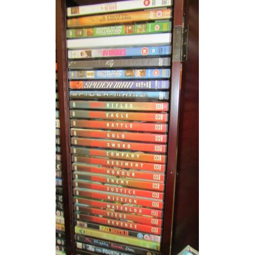 1 - A DVD cabinet with in excess of 150 DVD's and in excess of 70 CD's.