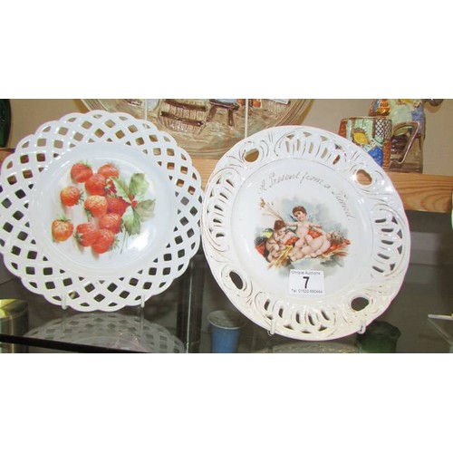 7 - Two Cherub and two floral ribbon plates.