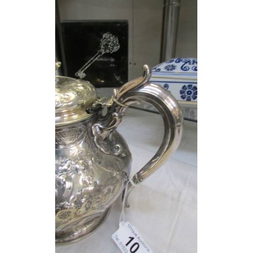 10 - An ornate silver plate teapot, lid needs fixing otherwise in good condition.