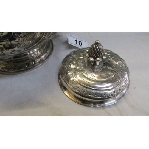 10 - An ornate silver plate teapot, lid needs fixing otherwise in good condition.