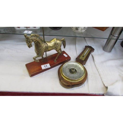 11 - A brass carousel horse and a barometer.