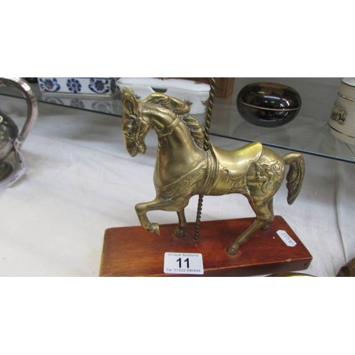 11 - A brass carousel horse and a barometer.