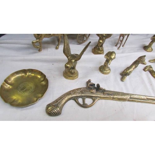 16 - A mixed lot of brassware including horse and cart, animals etc.,