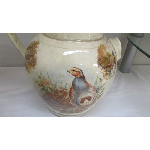 18 - A large Staffordshire pot hand painted with pheasants. COLLECT ONLY.