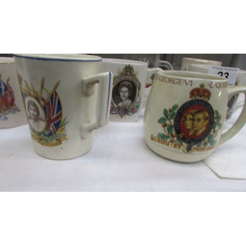 23 - A quantity of George VI and Elizabeth II coronation mugs.