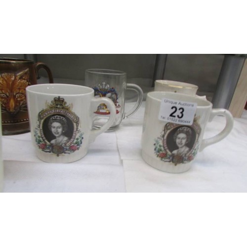 23 - A quantity of George VI and Elizabeth II coronation mugs.