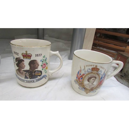 23 - A quantity of George VI and Elizabeth II coronation mugs.