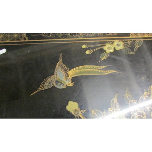 1707 - A black lacquered coffee table decorated with birds. COLLECT ONLY.