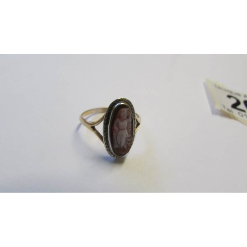 203 - A 9ct gold oval cameo ring and a 9ct gold signet ring, both size L.