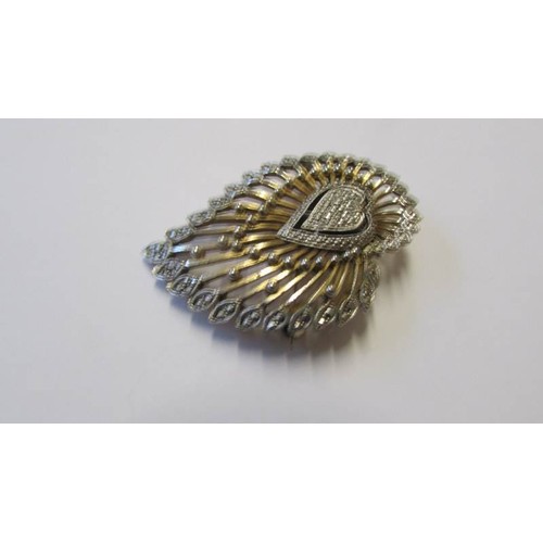 213 - A silver marcasite ring with mother of pearl and an unusual marcasite brooch,.