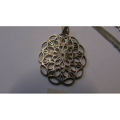 228 - A silver filigree pendant on silver chain.