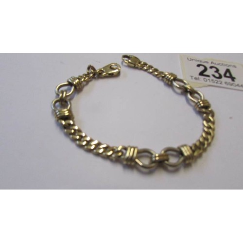 234 - A yellow and white gold bracelet, marked 375, 18 grams.