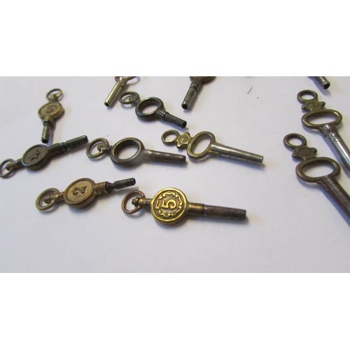 246 - Sixteen assorted pocket watch keys.