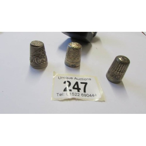 247 - Three silver thimbles including one in case,.