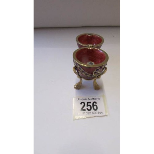 256 - A Faberge' style egg trinket box on stand.