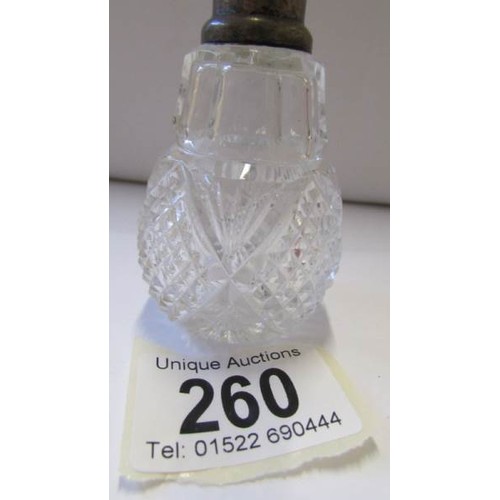 260 - A glass perfume bottle with silver collar and original stopper.