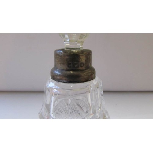 260 - A glass perfume bottle with silver collar and original stopper.