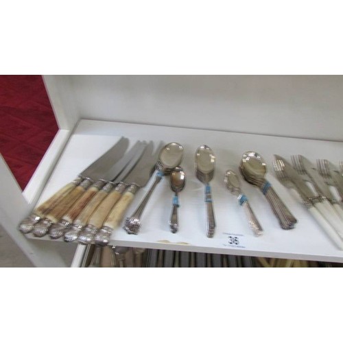 36 - A mixed lot of cutlery including fish knives and forks.