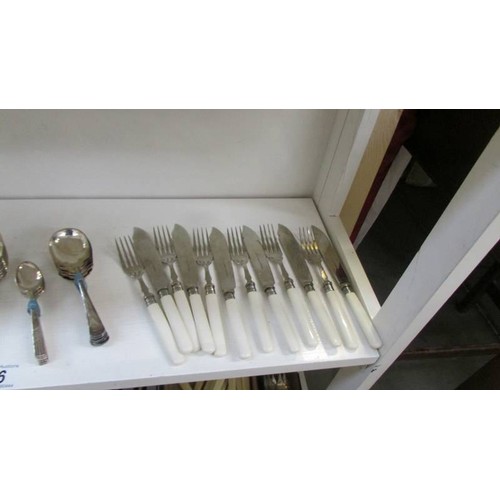 36 - A mixed lot of cutlery including fish knives and forks.