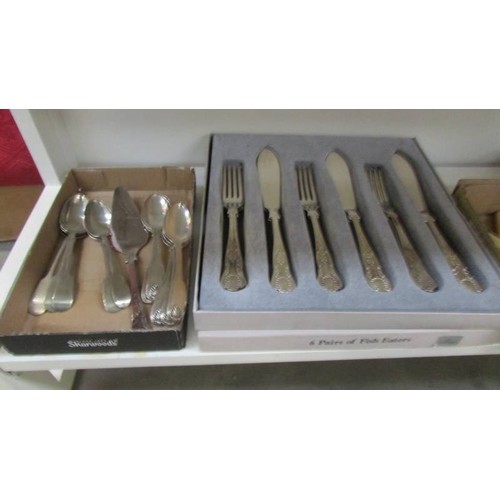 36 - A mixed lot of cutlery including fish knives and forks.