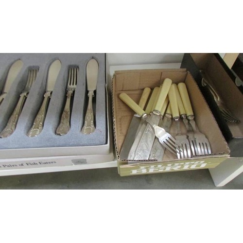 36 - A mixed lot of cutlery including fish knives and forks.