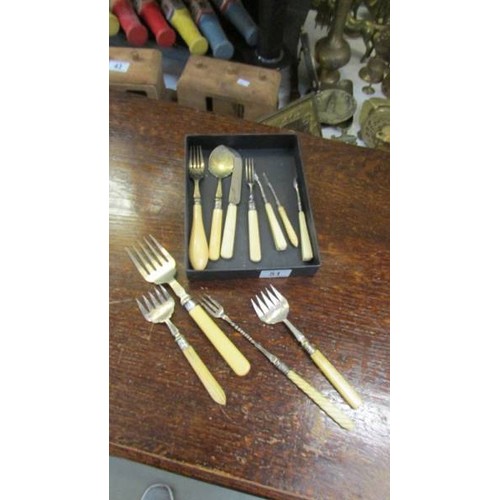 51 - A mixed lot of bone handled cutlery.