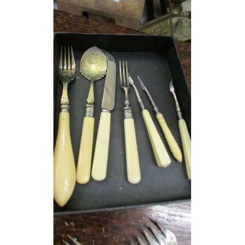 51 - A mixed lot of bone handled cutlery.